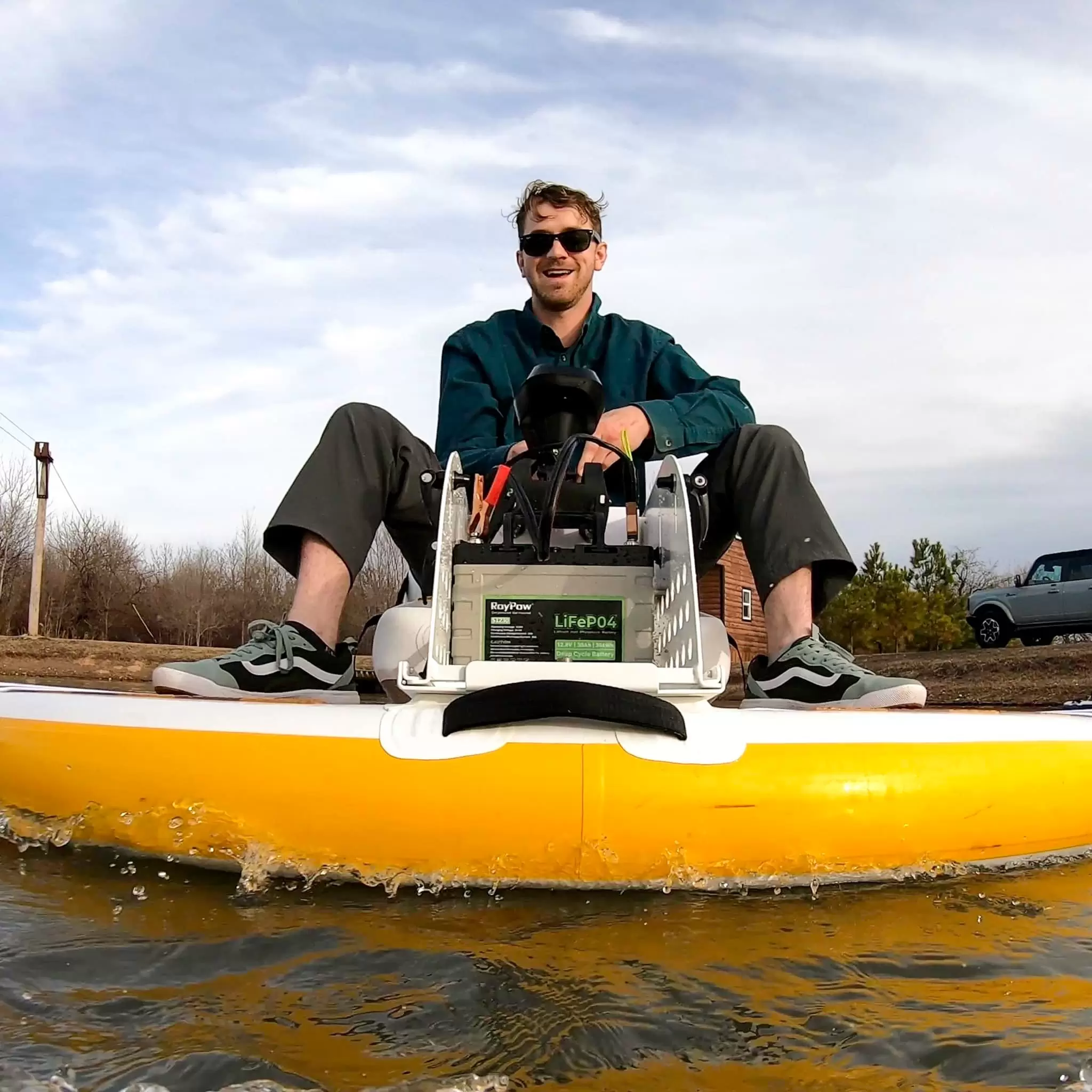 Person kayaking with motor on lake